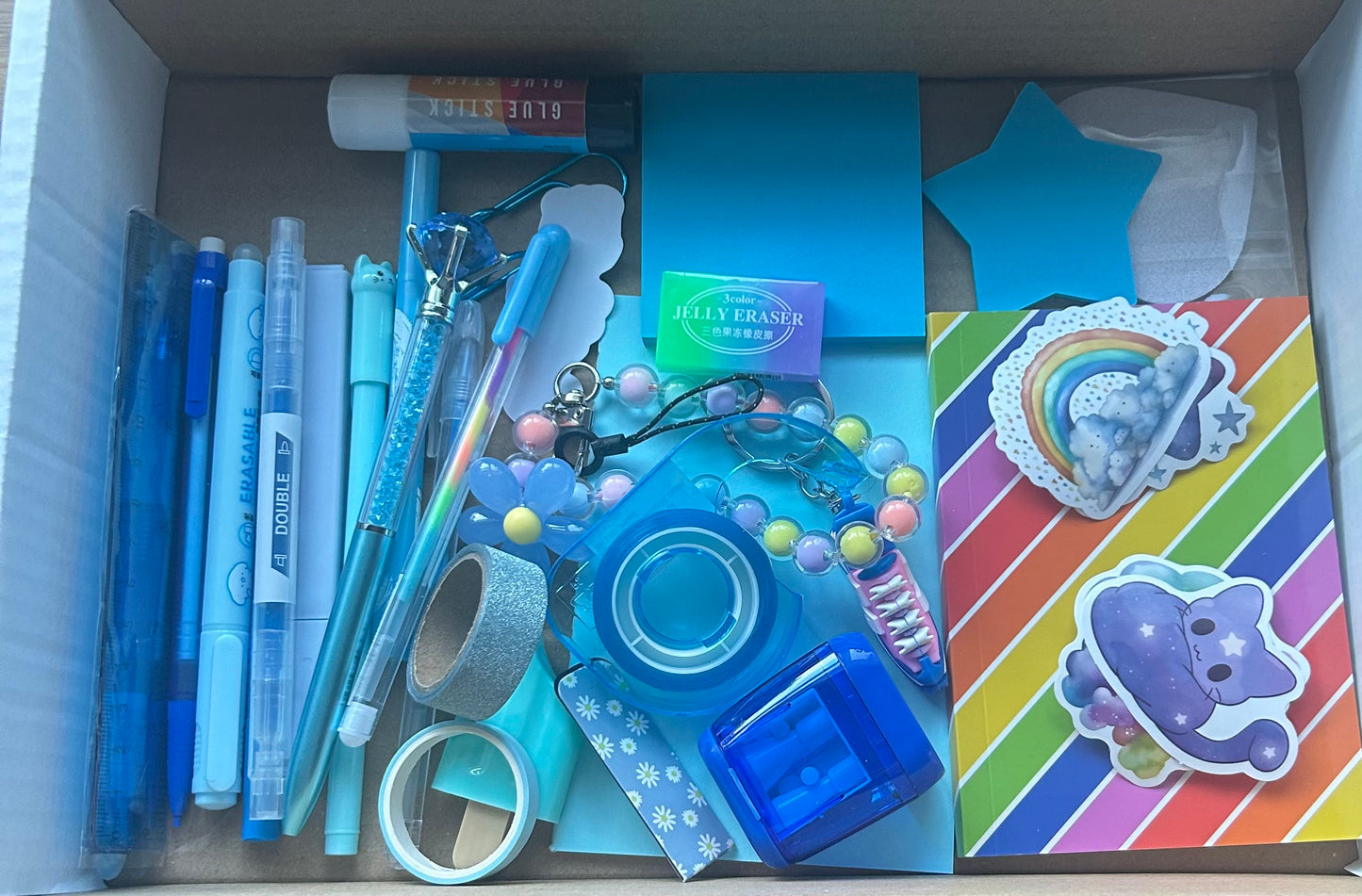 Selection of Stationery Box- A perfect gift idea, this vibrant kit includes a variety of essentials such as Washi Tape, Gel Pens, Notebooks, Sticky Notes, and more. Available in a range of colors to suit every style and creative need.