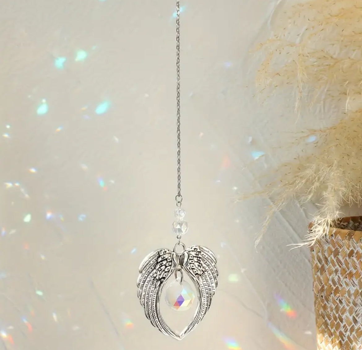 Sun Catcher – Angel Wings with Crystal
A graceful sun catcher featuring delicate angel wings and a shimmering crystal, perfect for bringing a touch of elegance and serenity to your space as it catches the light.
