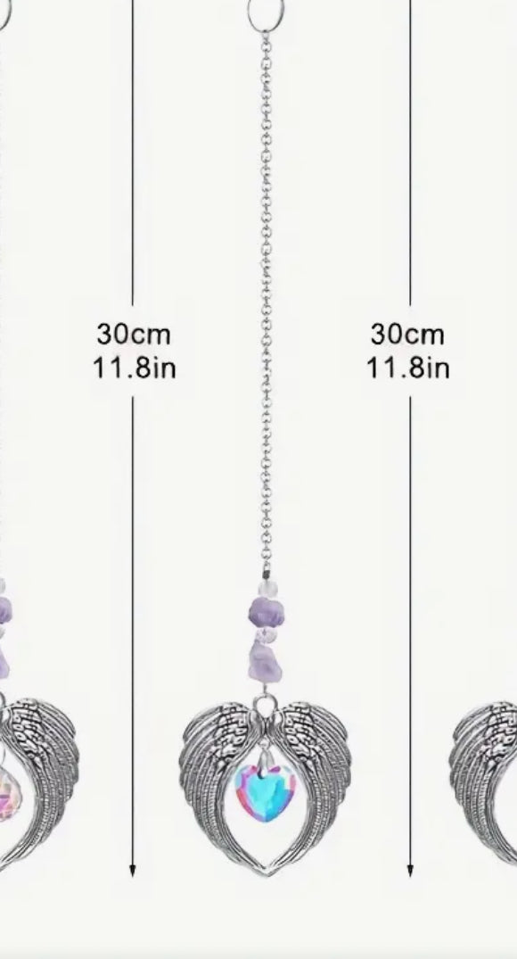 Sun Catcher – Angel Wings with Purple Heart Crystal
A beautifully crafted sun catcher featuring delicate angel wings and a stunning purple & heart crystal. Perfect for adding a touch of elegance and positive energy to any room.